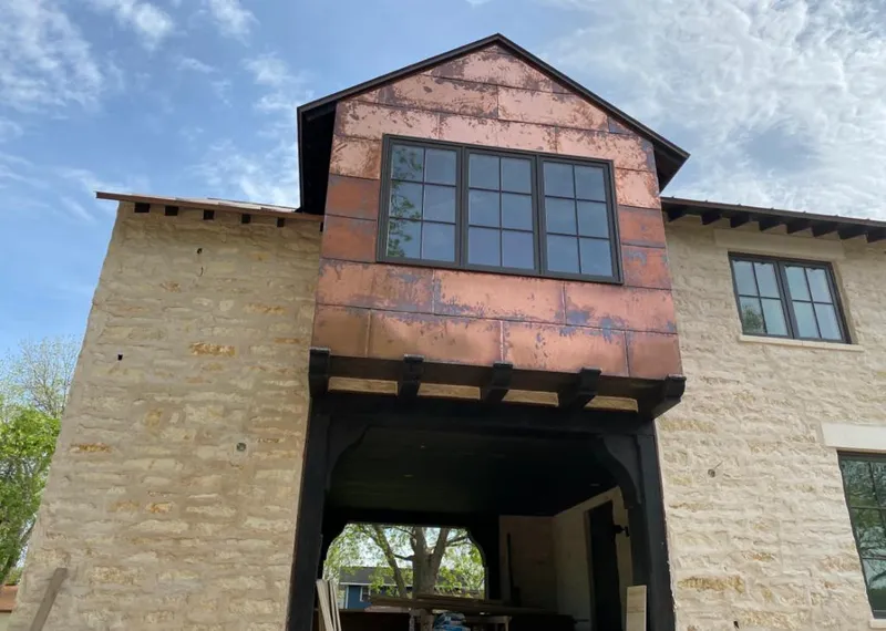 Copper metal panel facade on a stone building for Skylight Installation in Grove City